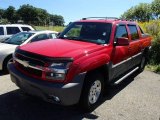 Victory Red Chevrolet Avalanche in 2002