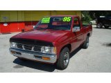 Cherry Red Pearl Metallic Nissan Hardbody Truck in 1995