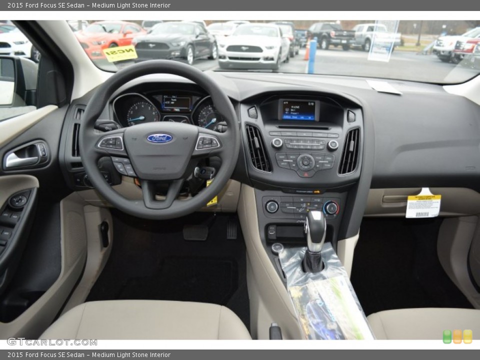 Medium Light Stone Interior Dashboard for the 2015 Ford Focus SE Sedan #100741100