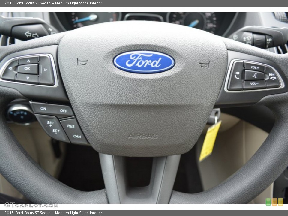 Medium Light Stone Interior Steering Wheel for the 2015 Ford Focus SE Sedan #100741259