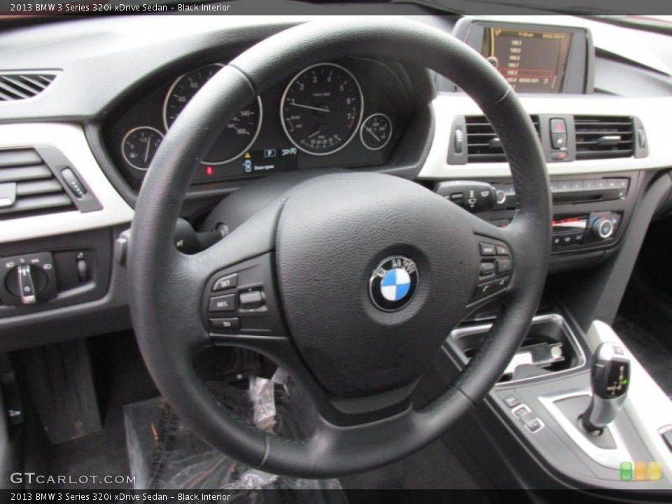 Black Interior Steering Wheel for the 2013 BMW 3 Series 320i xDrive Sedan #100932581