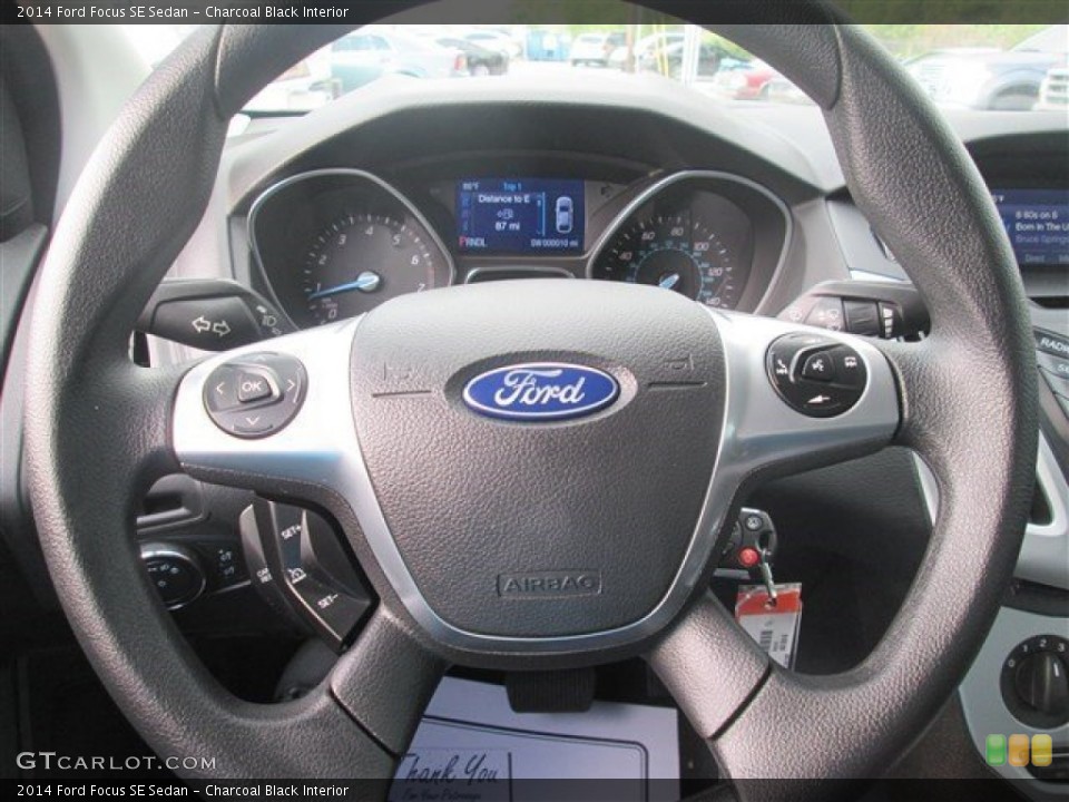 Charcoal Black Interior Steering Wheel for the 2014 Ford Focus SE Sedan #101960848