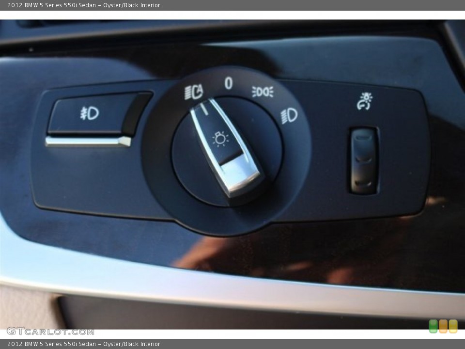 Oyster/Black Interior Controls for the 2012 BMW 5 Series 550i Sedan #102094875