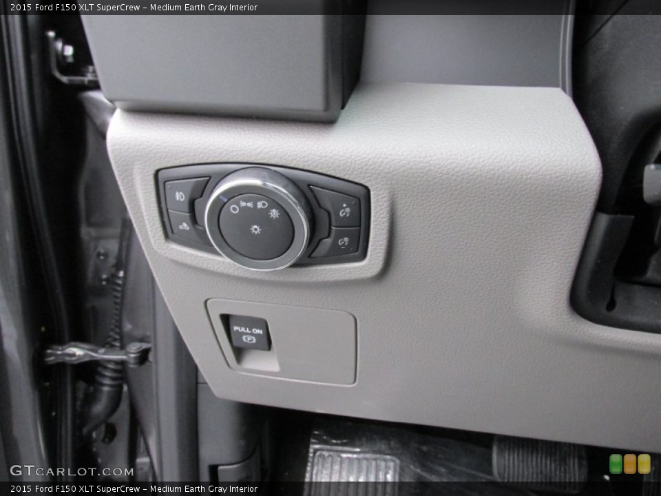 Medium Earth Gray Interior Controls for the 2015 Ford F150 XLT SuperCrew #102104190