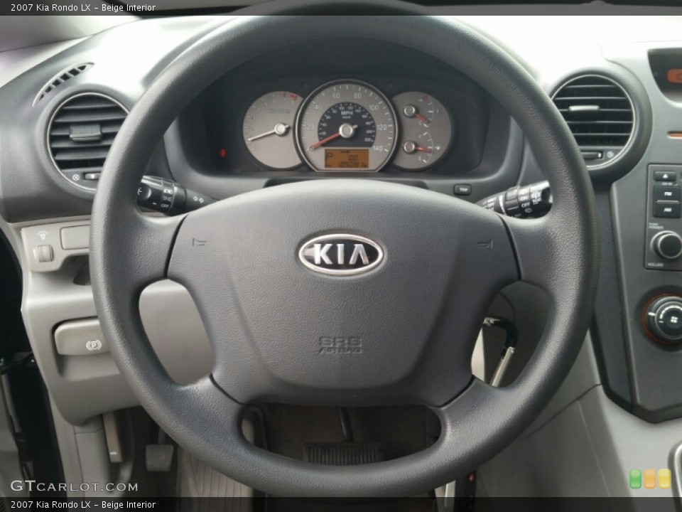 Beige Interior Steering Wheel for the 2007 Kia Rondo LX #102122163