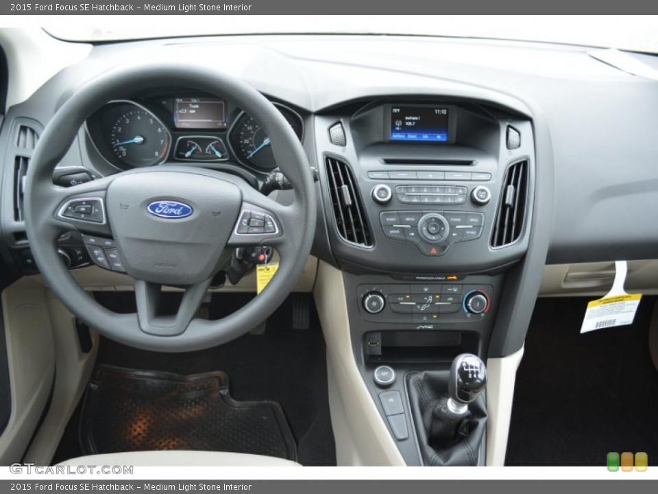 Medium Light Stone Interior Dashboard for the 2015 Ford Focus SE Hatchback #103028190