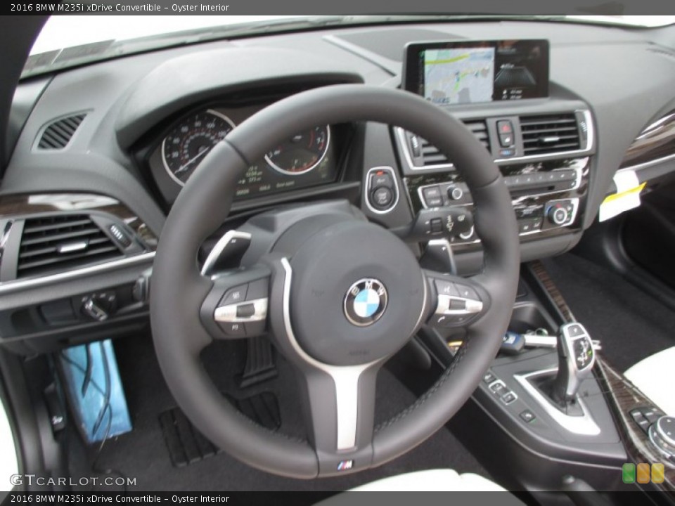 Oyster Interior Steering Wheel for the 2016 BMW M235i xDrive Convertible #106627681