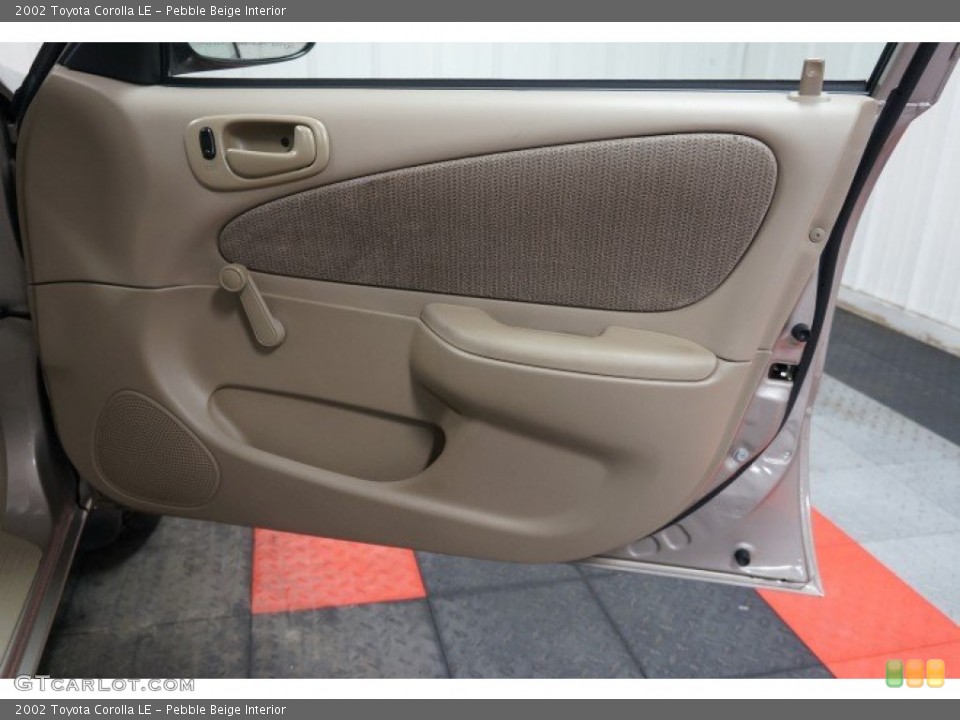 Pebble Beige Interior Door Panel for the 2002 Toyota Corolla LE #107425985