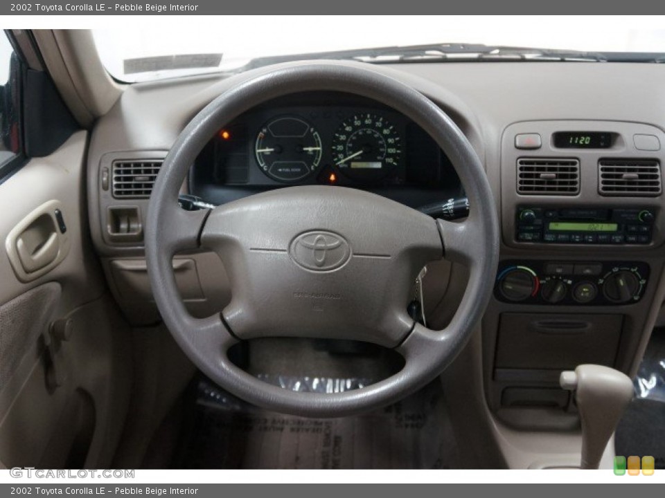 Pebble Beige Interior Steering Wheel for the 2002 Toyota Corolla LE #107426075