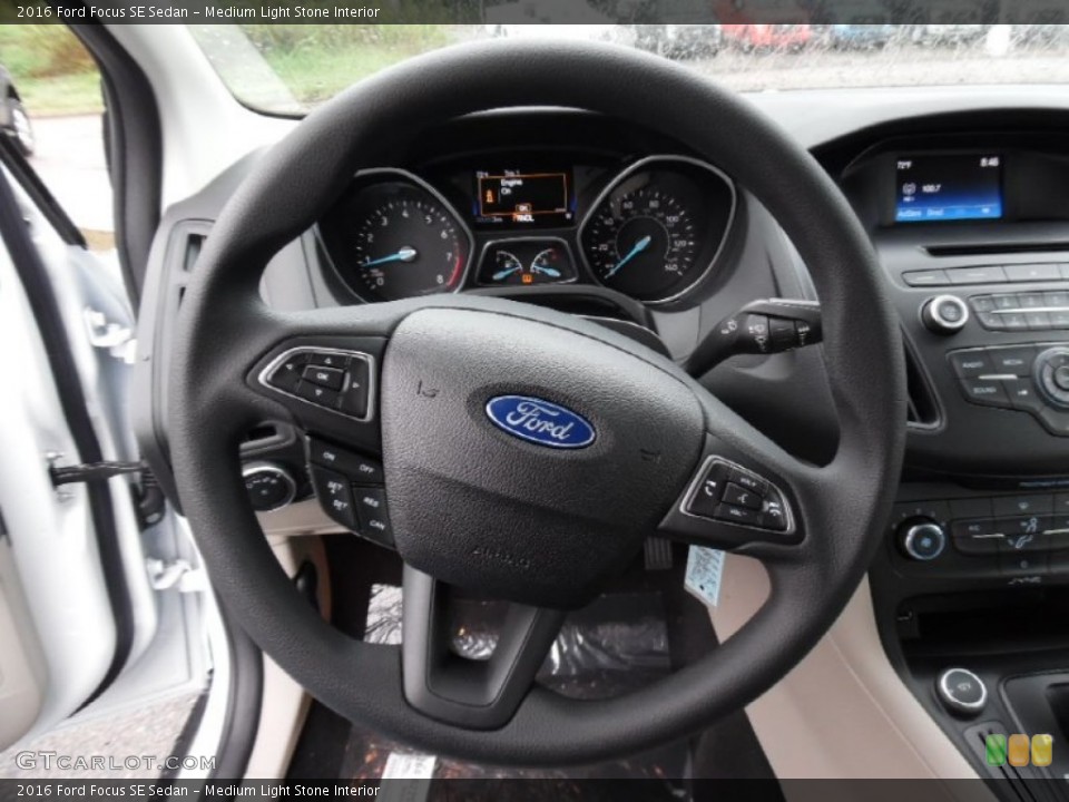 Medium Light Stone Interior Steering Wheel for the 2016 Ford Focus SE Sedan #107518304