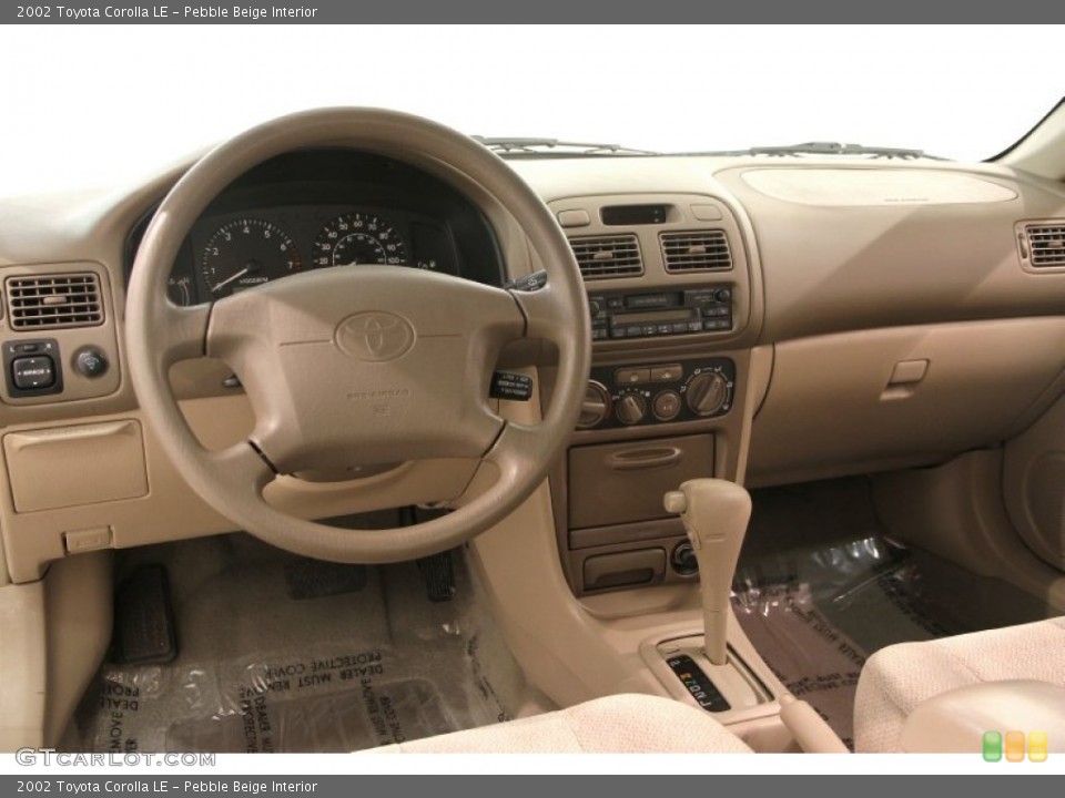 Pebble Beige Interior Dashboard for the 2002 Toyota Corolla LE #107745143