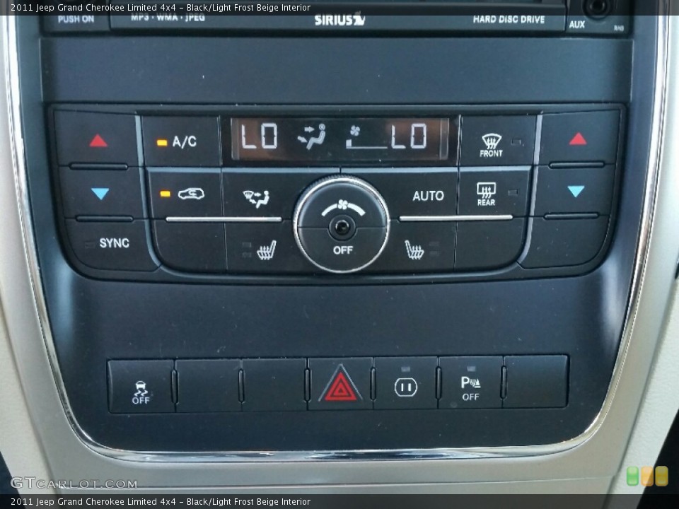Black/Light Frost Beige Interior Controls for the 2011 Jeep Grand Cherokee Limited 4x4 #107864376