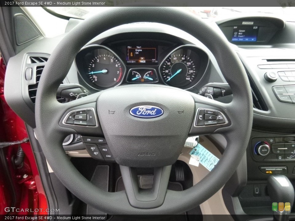 Medium Light Stone Interior Steering Wheel for the 2017 Ford Escape SE 4WD #112485410