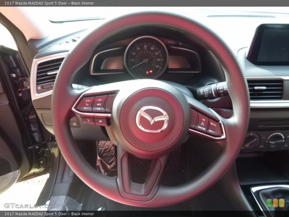 Black Interior Steering Wheel for the 2017 Mazda MAZDA3 Sport 5 Door #116414504
