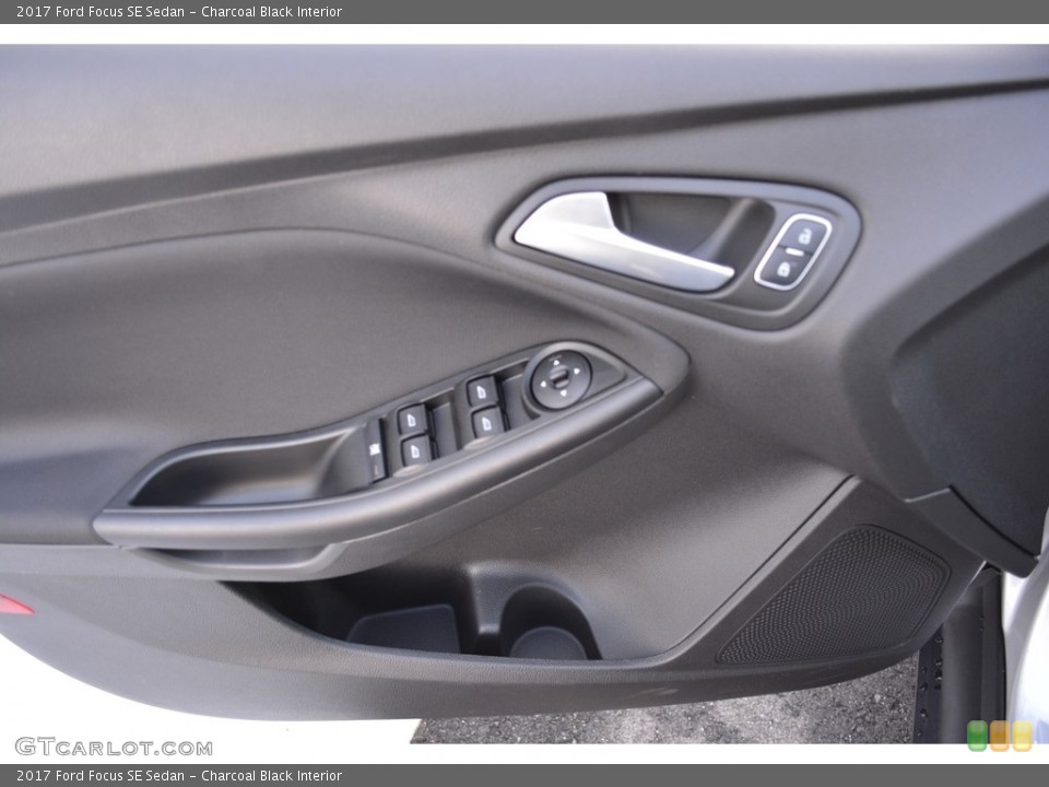 Charcoal Black Interior Door Panel for the 2017 Ford Focus SE Sedan #117368407