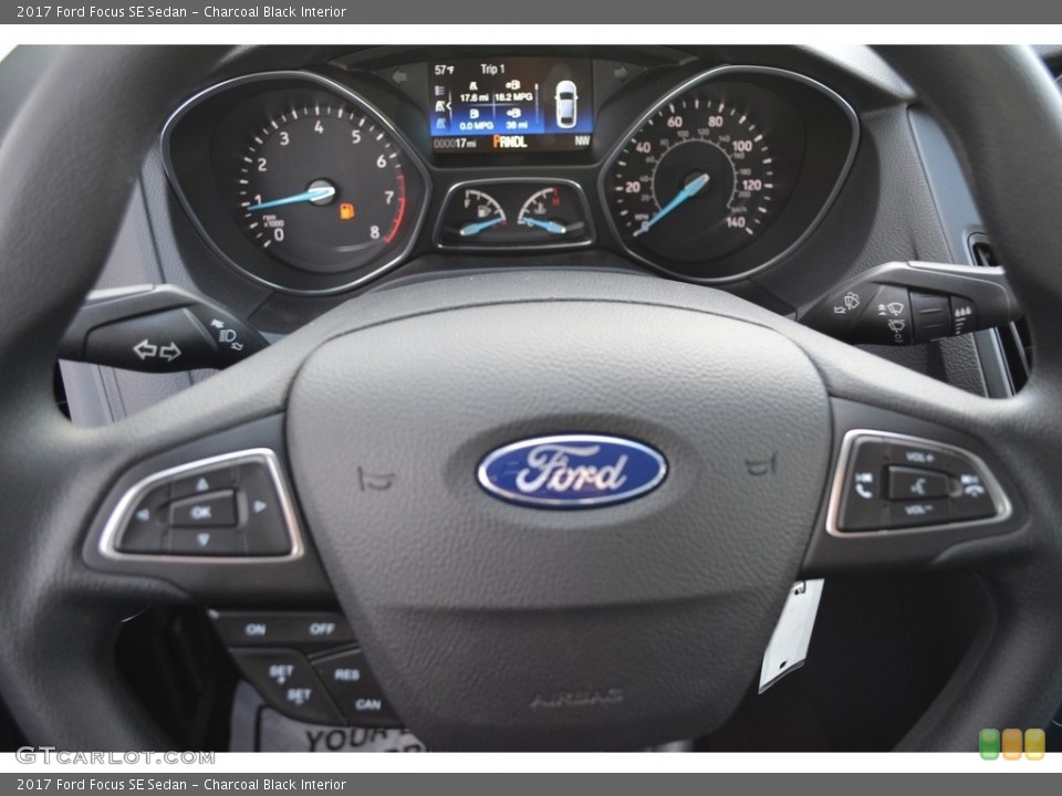 Charcoal Black Interior Steering Wheel for the 2017 Ford Focus SE Sedan #117368644