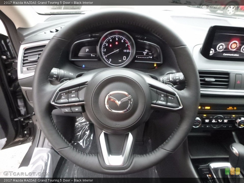 Black Interior Steering Wheel for the 2017 Mazda MAZDA3 Grand Touring 5 Door #117435312