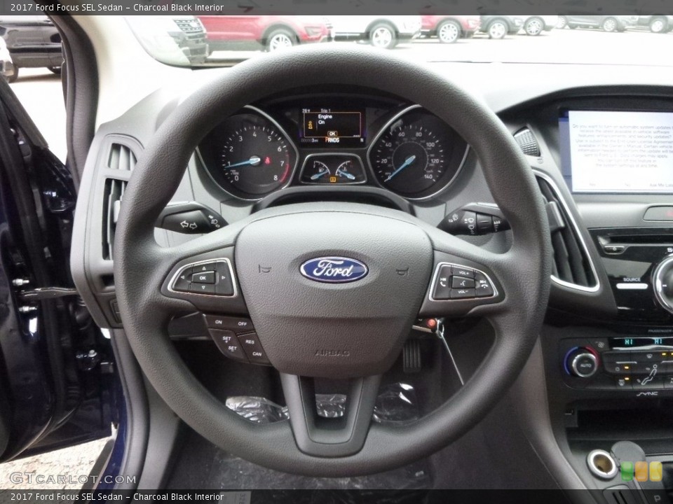 Charcoal Black Interior Steering Wheel for the 2017 Ford Focus SEL Sedan #117488276