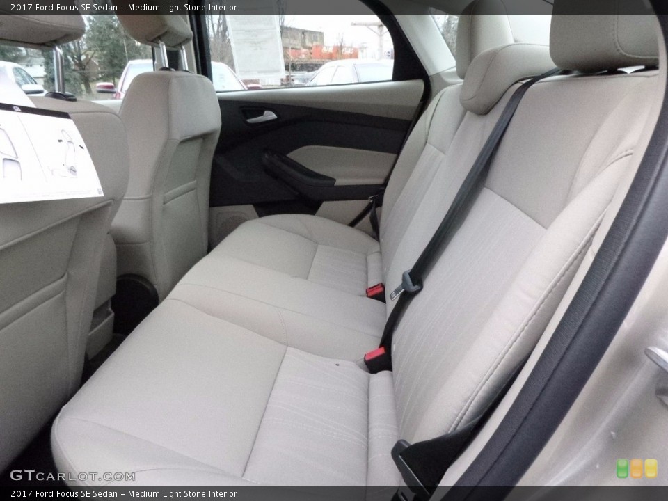 Medium Light Stone Interior Rear Seat for the 2017 Ford Focus SE Sedan #117516259