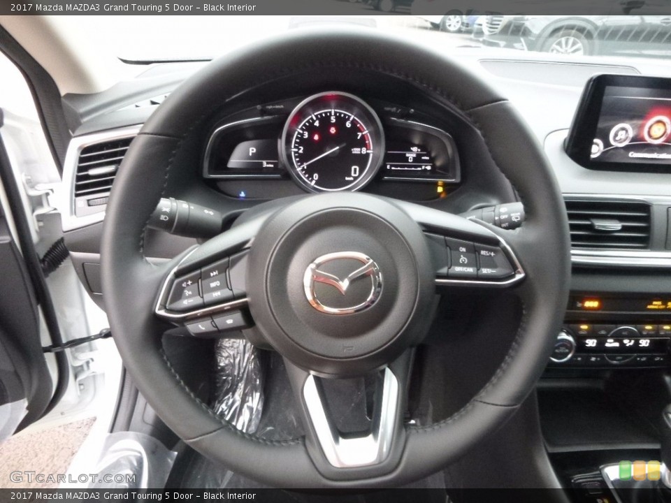 Black Interior Steering Wheel for the 2017 Mazda MAZDA3 Grand Touring 5 Door #117517942