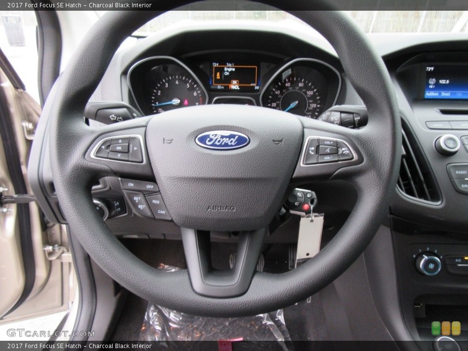 Charcoal Black Interior Steering Wheel for the 2017 Ford Focus SE Hatch #117546794