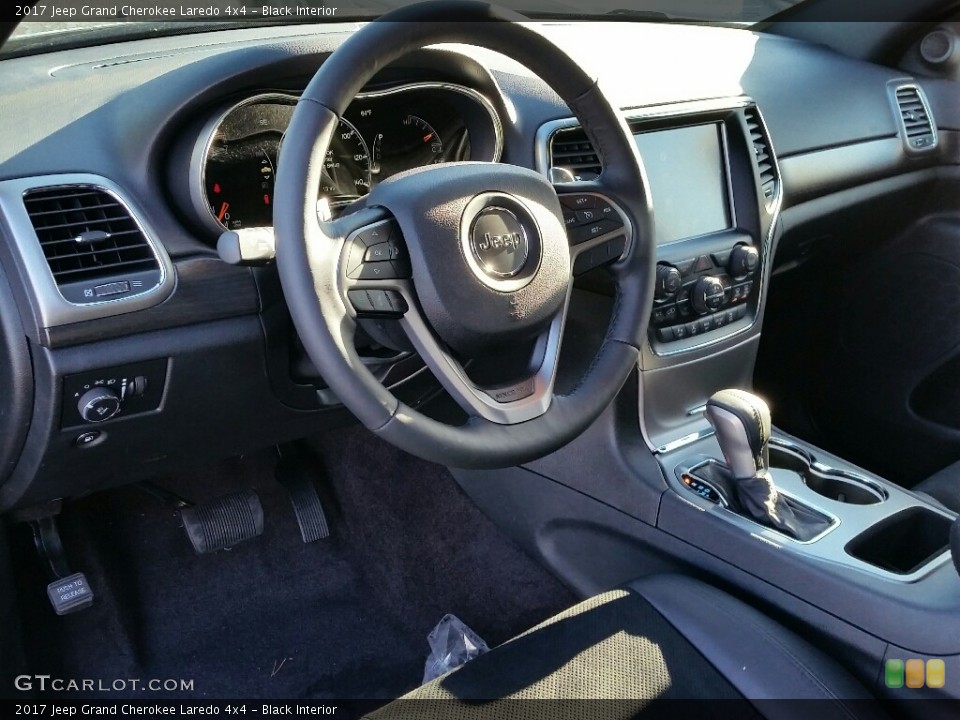 Black Interior Dashboard for the 2017 Jeep Grand Cherokee Laredo 4x4 #117658356