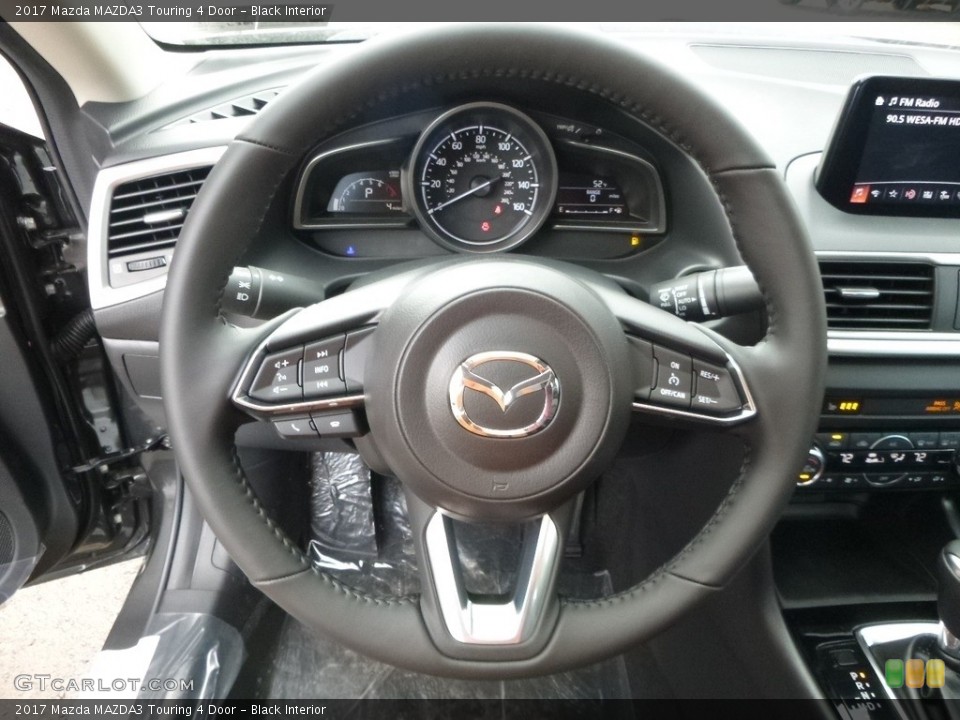 Black Interior Steering Wheel for the 2017 Mazda MAZDA3 Touring 4 Door #117765890