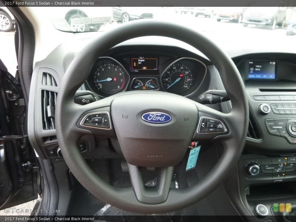 Charcoal Black Interior Steering Wheel for the 2017 Ford Focus S Sedan #117855556