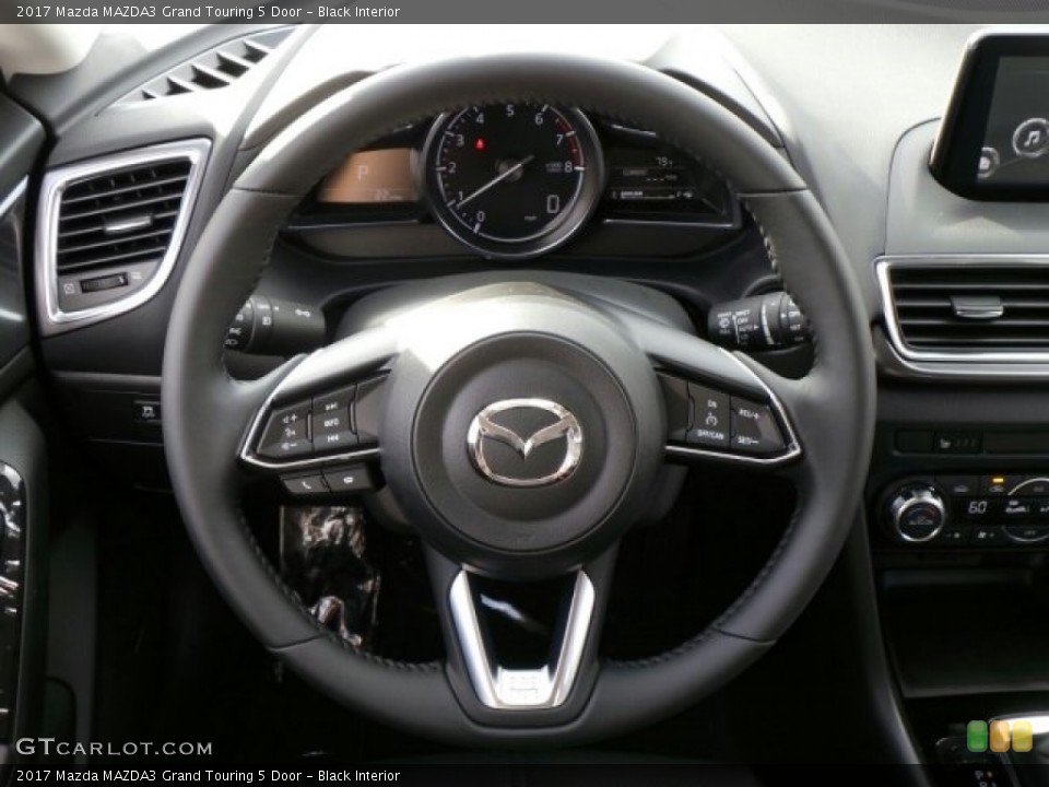 Black Interior Steering Wheel for the 2017 Mazda MAZDA3 Grand Touring 5 Door #118157955