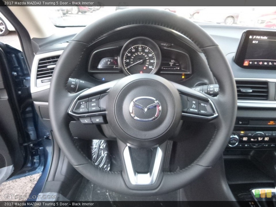 Black Interior Steering Wheel for the 2017 Mazda MAZDA3 Touring 5 Door #118256400