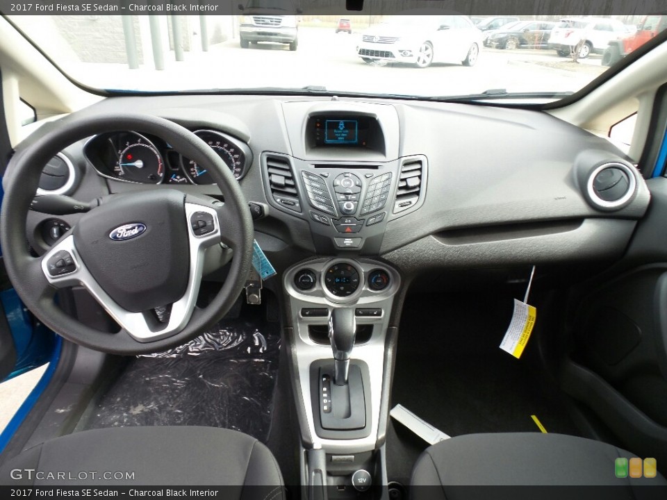 Charcoal Black Interior Dashboard for the 2017 Ford Fiesta SE Sedan #118981116