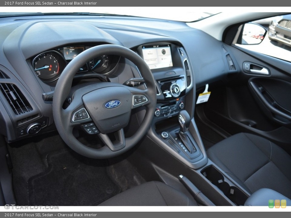Charcoal Black Interior Dashboard for the 2017 Ford Focus SEL Sedan #119282354