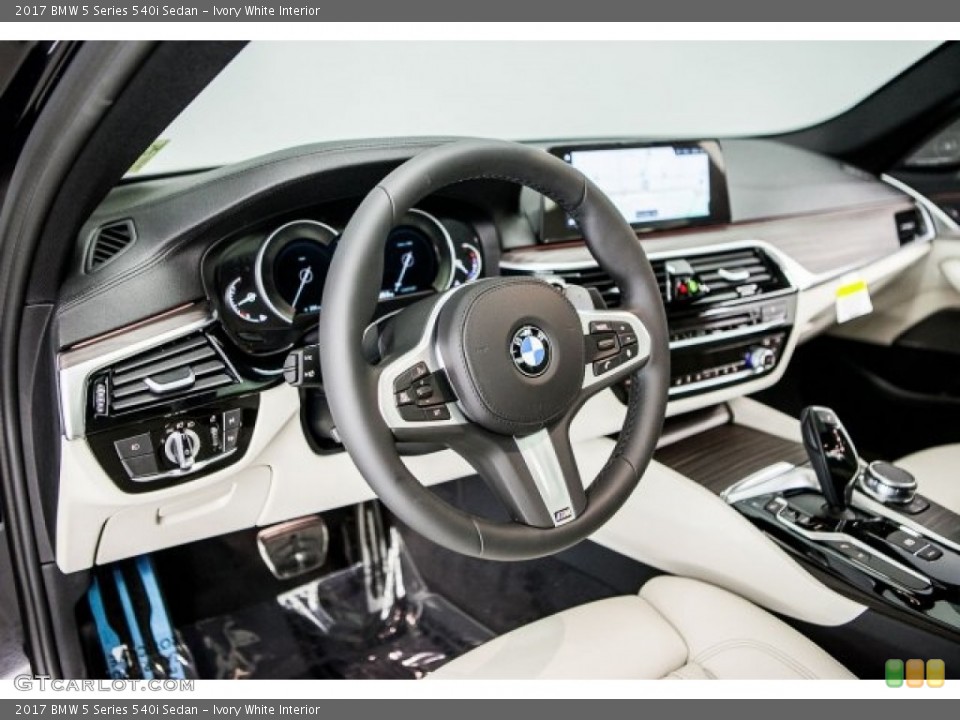 Ivory White Interior Dashboard for the 2017 BMW 5 Series 540i Sedan #119528971