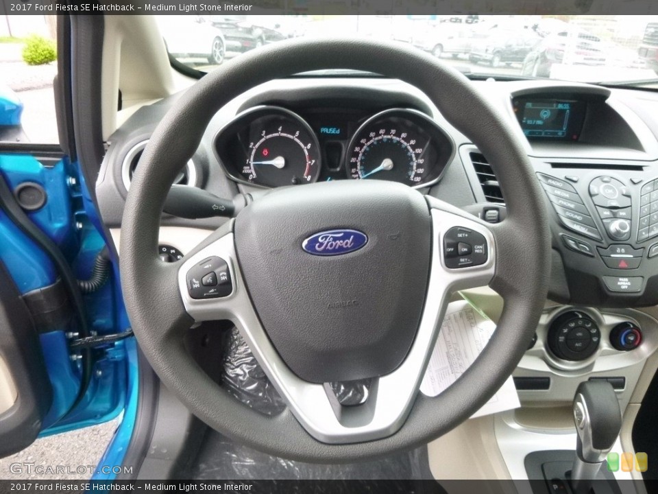 Medium Light Stone Interior Steering Wheel for the 2017 Ford Fiesta SE Hatchback #119980738