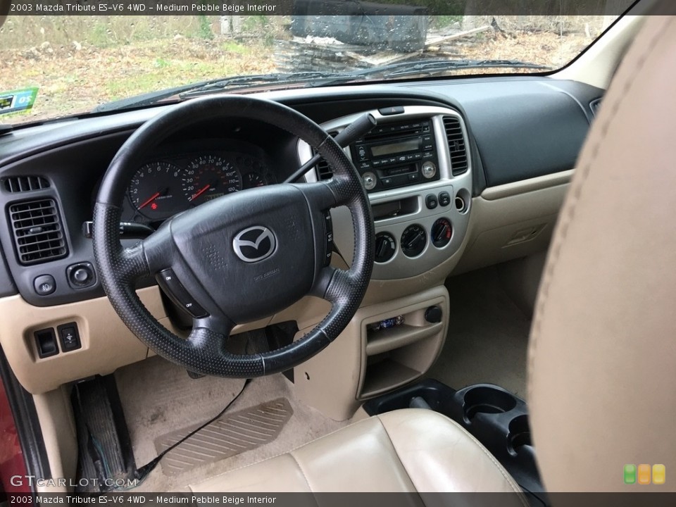 Medium Pebble Beige Interior Dashboard for the 2003 Mazda Tribute ES-V6 4WD #120007498