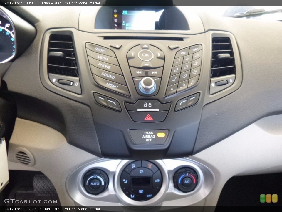 Medium Light Stone Interior Controls for the 2017 Ford Fiesta SE Sedan #120224783