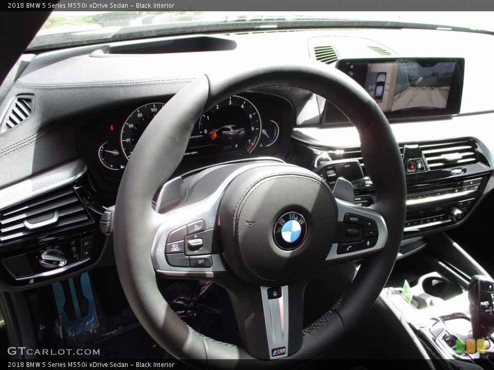Black Interior Steering Wheel for the 2018 BMW 5 Series M550i xDrive Sedan #120242736