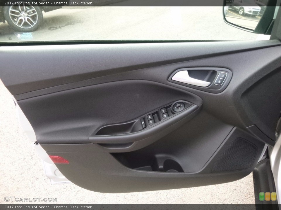 Charcoal Black Interior Door Panel for the 2017 Ford Focus SE Sedan #120759505