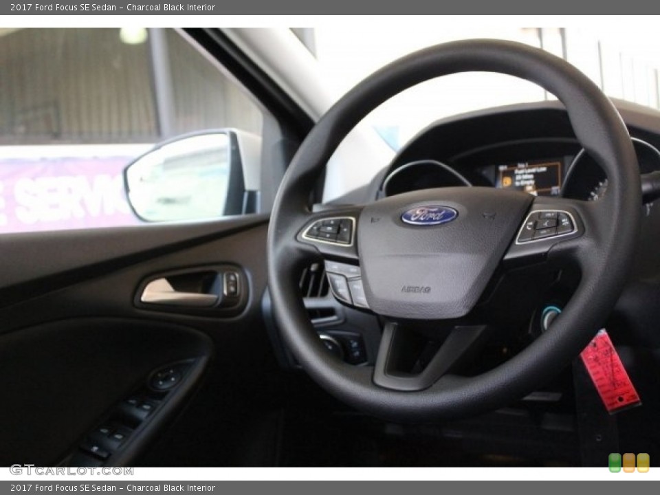 Charcoal Black Interior Steering Wheel for the 2017 Ford Focus SE Sedan #121128552