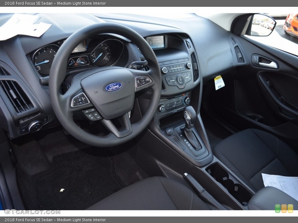 Medium Light Stone Interior Dashboard for the 2018 Ford Focus SE Sedan #123652486