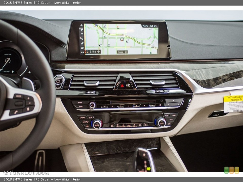 Ivory White Interior Dashboard for the 2018 BMW 5 Series 540i Sedan #123712760