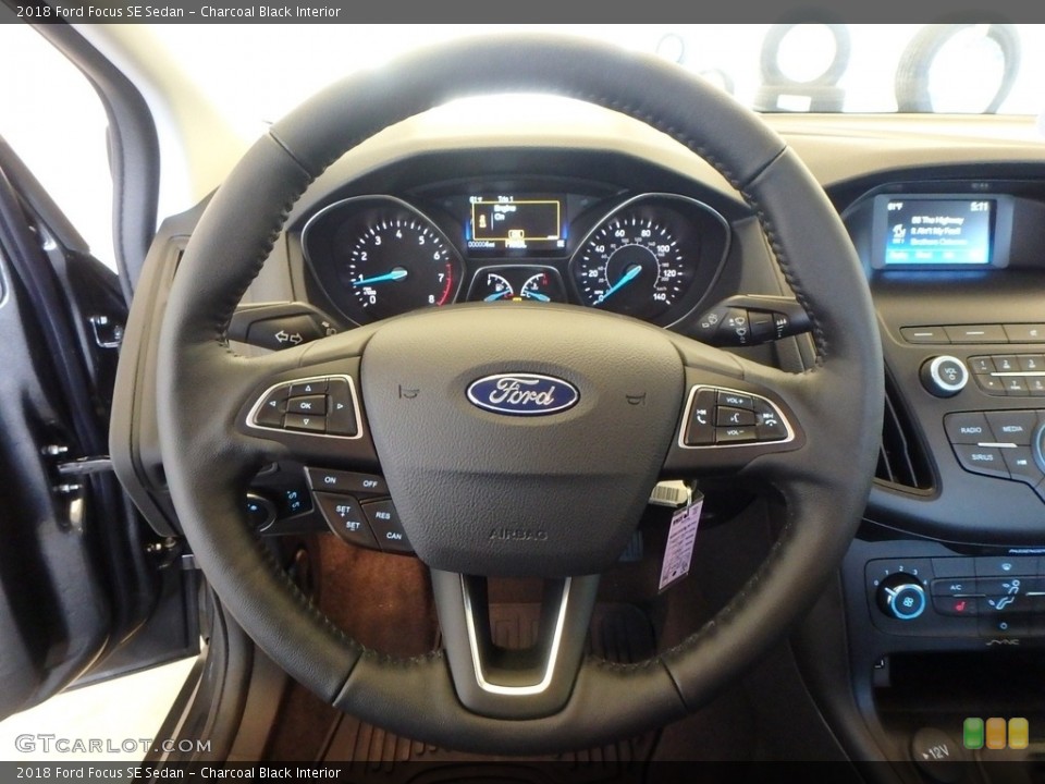 Charcoal Black Interior Steering Wheel for the 2018 Ford Focus SE Sedan #124152734