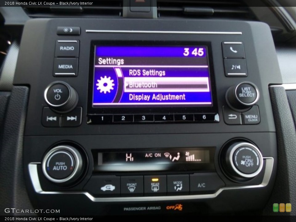 Black/Ivory Interior Controls for the 2018 Honda Civic LX Coupe #124690951