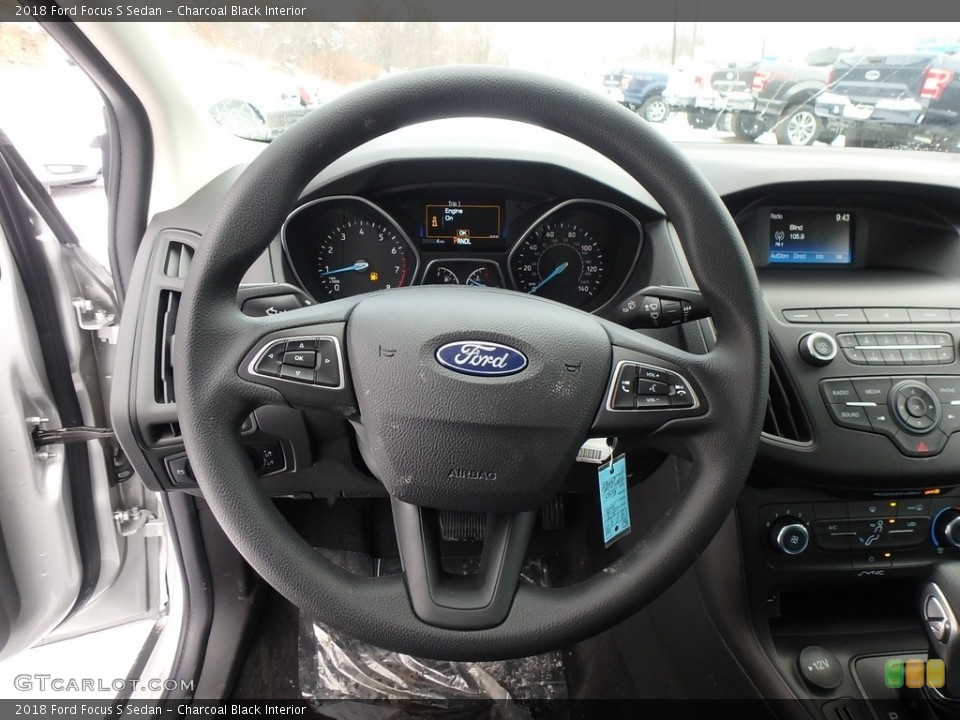 Charcoal Black Interior Steering Wheel for the 2018 Ford Focus S Sedan #124693239