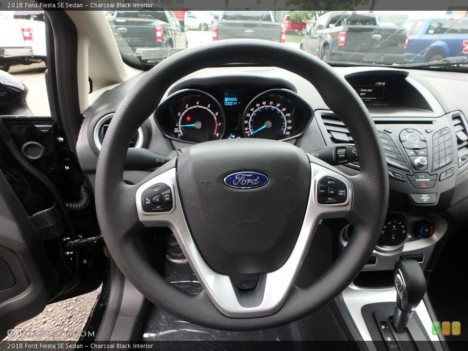 Charcoal Black Interior Steering Wheel for the 2018 Ford Fiesta SE Sedan #129449813