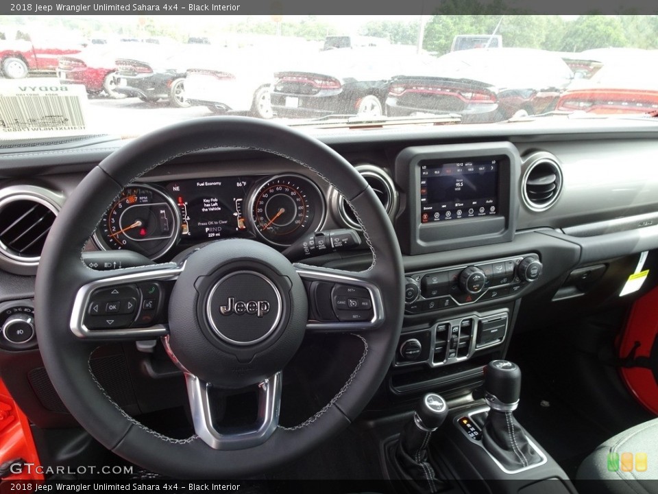 Black Interior Dashboard for the 2018 Jeep Wrangler Unlimited Sahara 4x4 #129581991