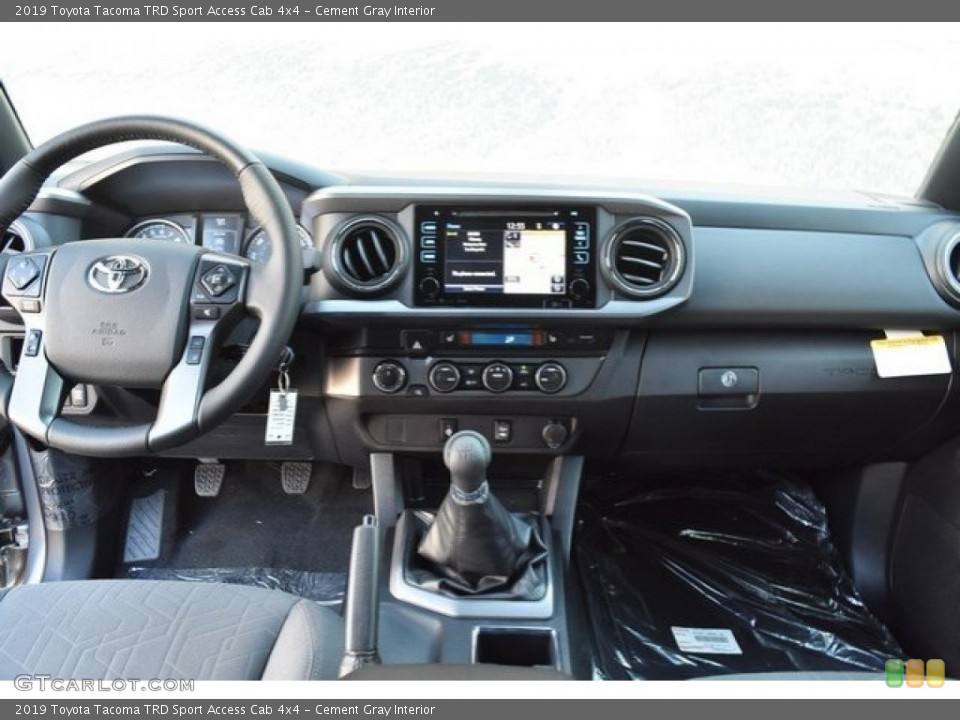 Cement Gray Interior Dashboard for the 2019 Toyota Tacoma TRD Sport Access Cab 4x4 #129595729