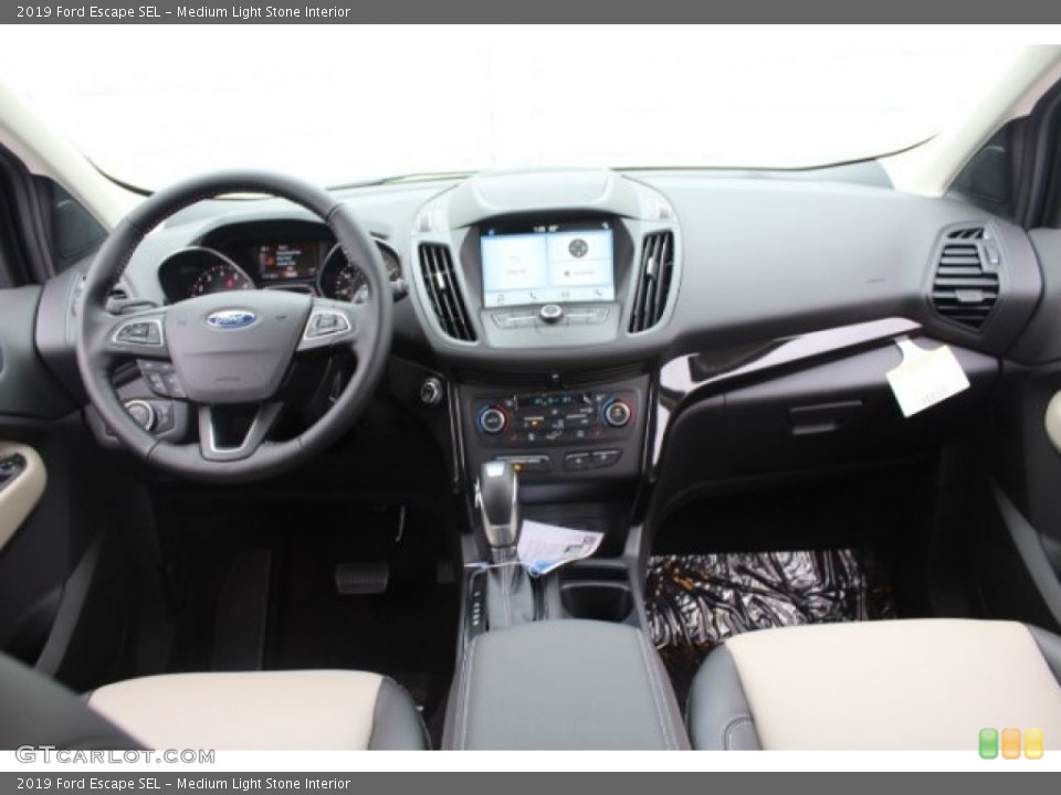 Medium Light Stone Interior Dashboard for the 2019 Ford Escape SEL #130575891