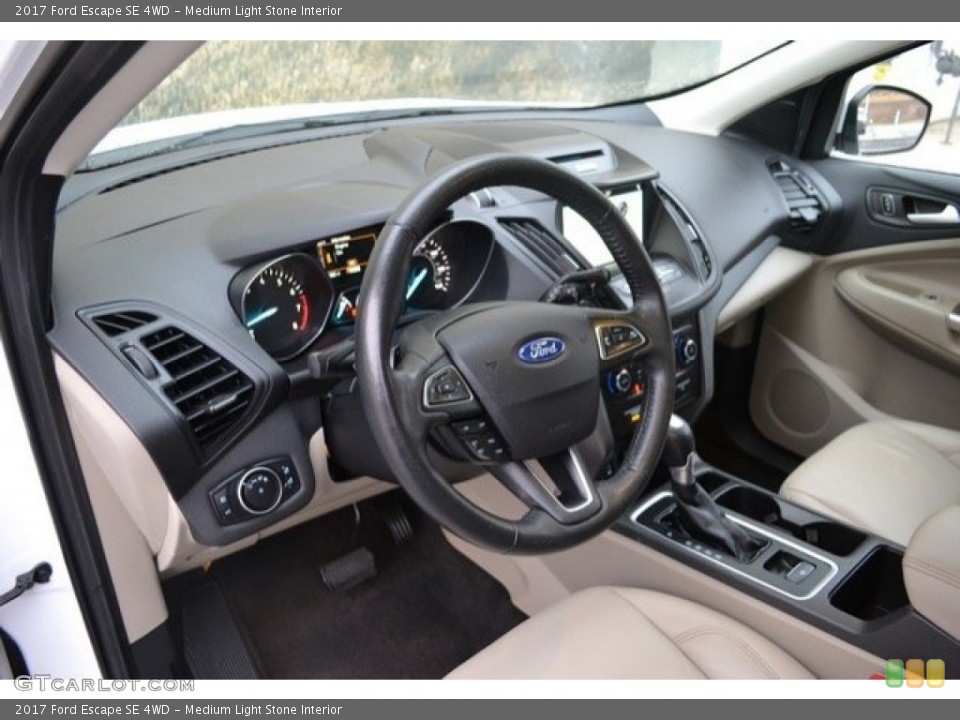 Medium Light Stone Interior Dashboard for the 2017 Ford Escape SE 4WD #130813863
