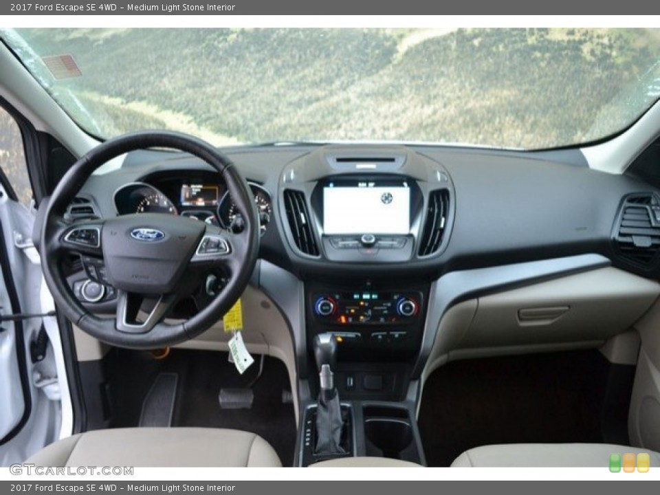 Medium Light Stone Interior Dashboard for the 2017 Ford Escape SE 4WD #130813884